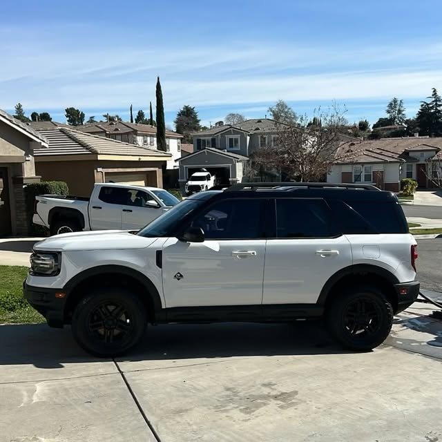 White Ford Bronco Sport with black wheels after a detail