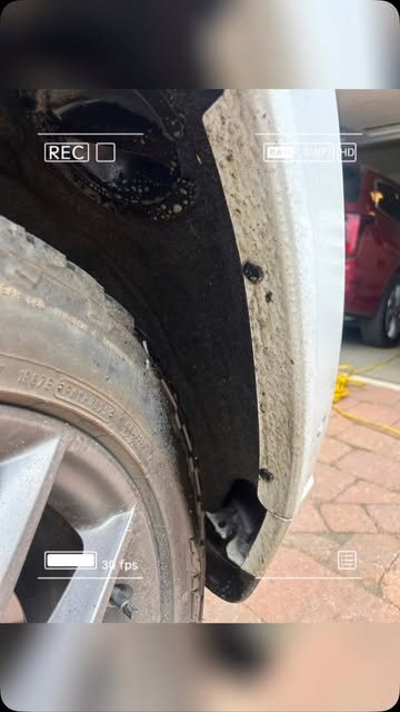 Tire and wheel well being cleaned